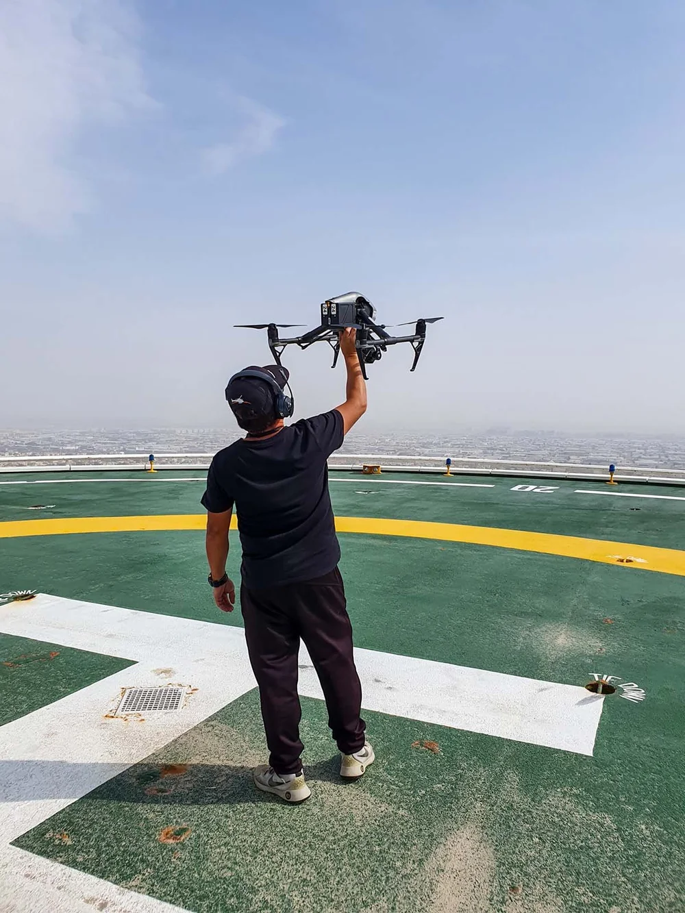 ChopperShoot pilot launching an Inspire drone from the Burj Al Arab helipad in Dubai