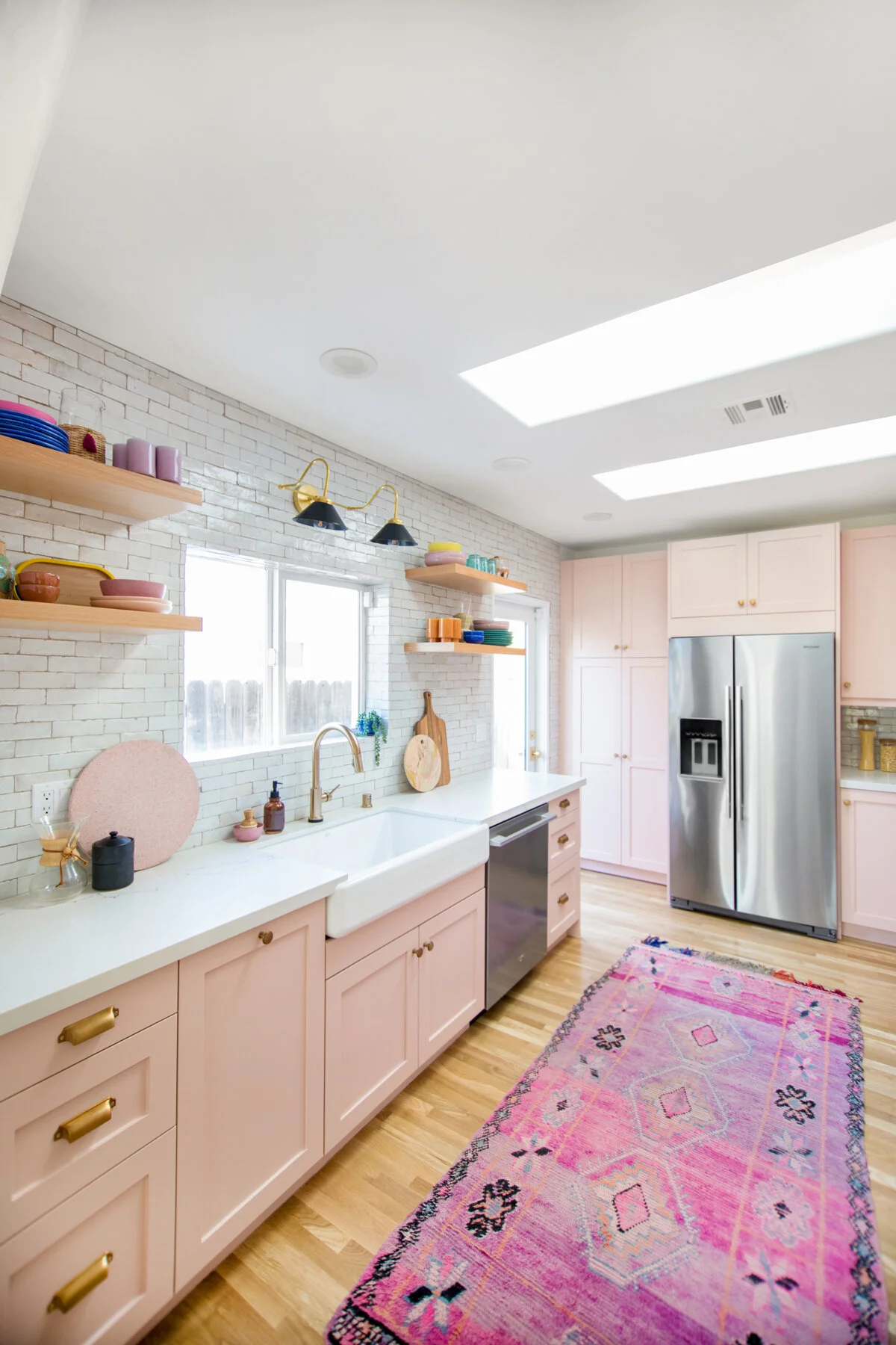 Of course when I think pink kitchens Jeff and Kelly’s kitchen is always the first one to mind. Truly, truly obsessed. Paint on cabinets is Dunn Edwards Galveston Tan. Image via StudioDIY
