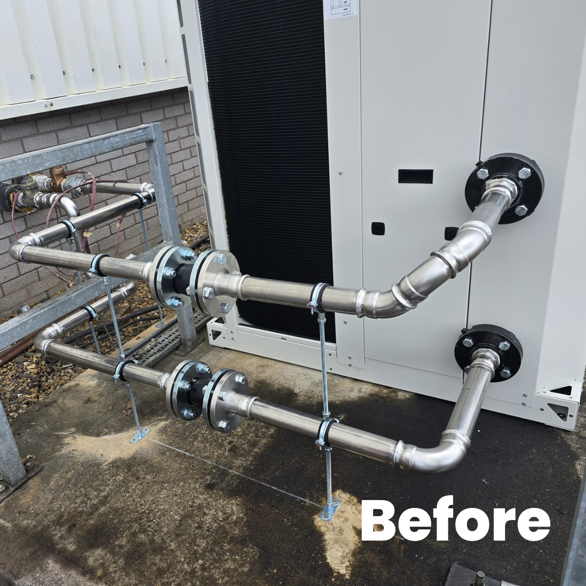 Metal pipes connected to an HVAC unit outside on a concrete pad, with a metal frame and some piping on the side, labeled 'Before'.