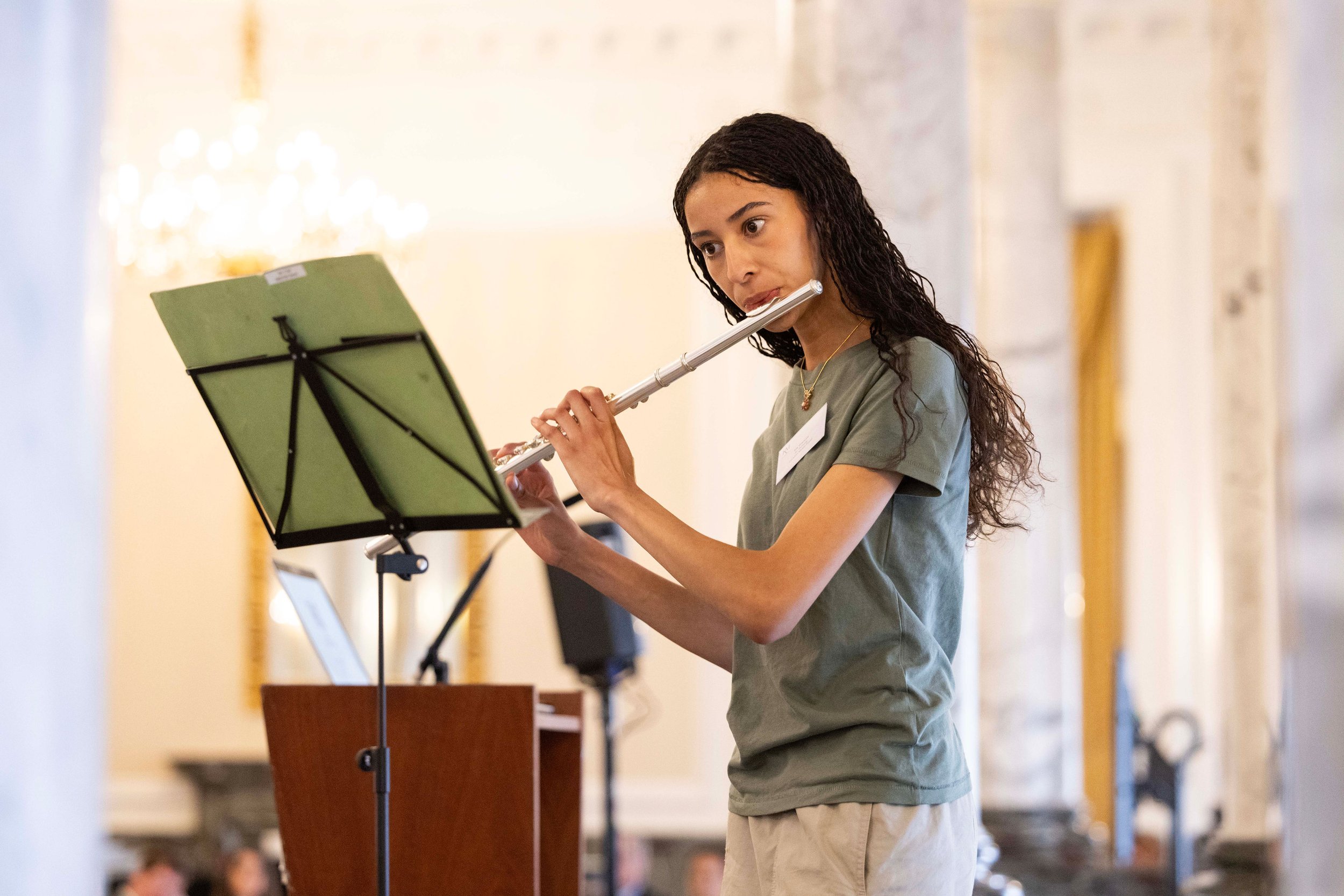 A young flautist performing solo