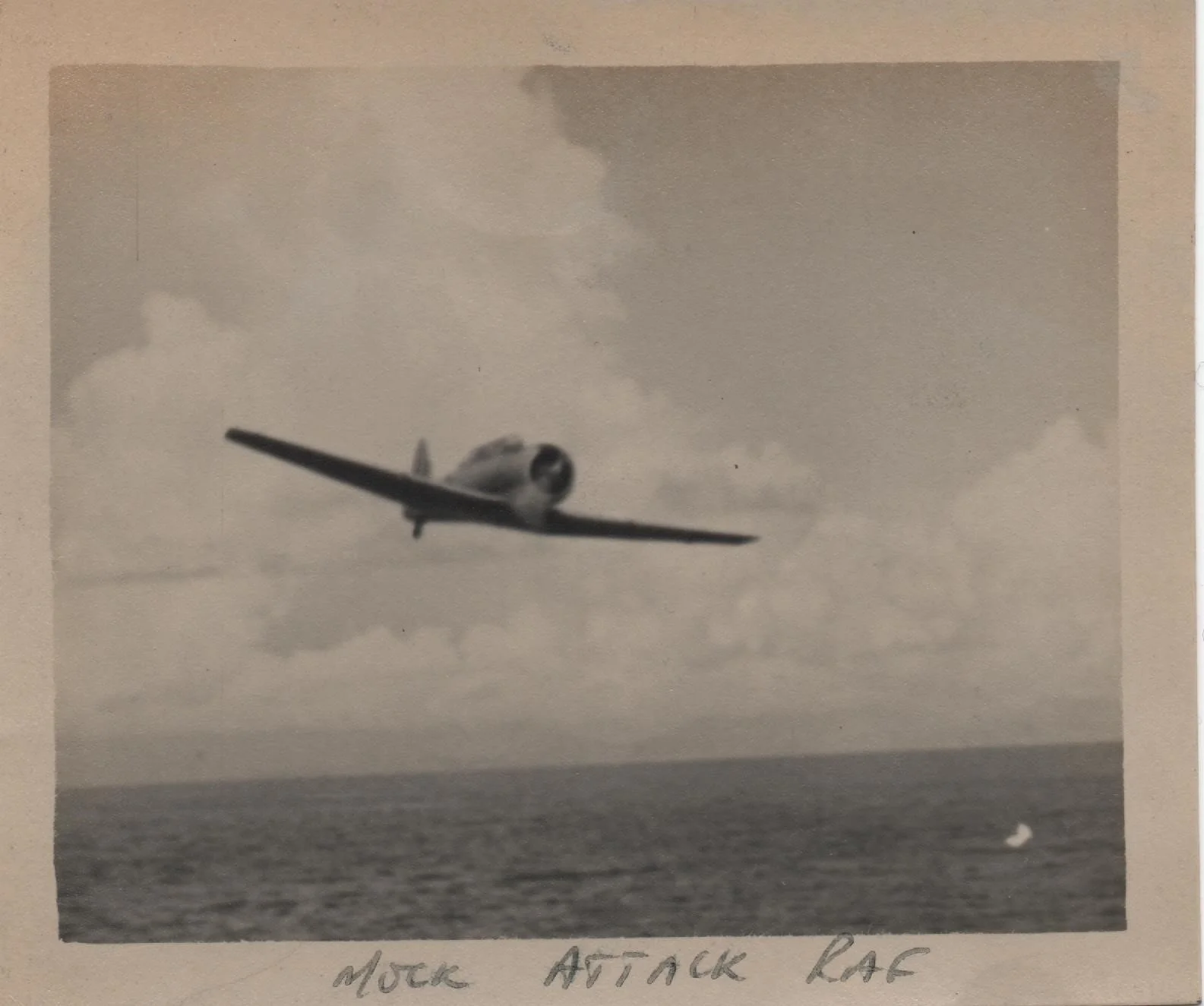 HMS Belfast Mock attack 1 RAF Harvard trainer.jpeg