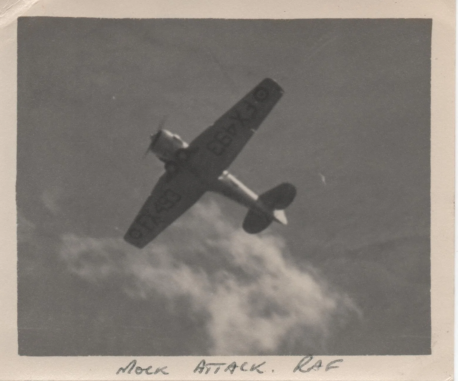 HMS Belfast Mock attack 2 RAF Harvard trainer.jpeg