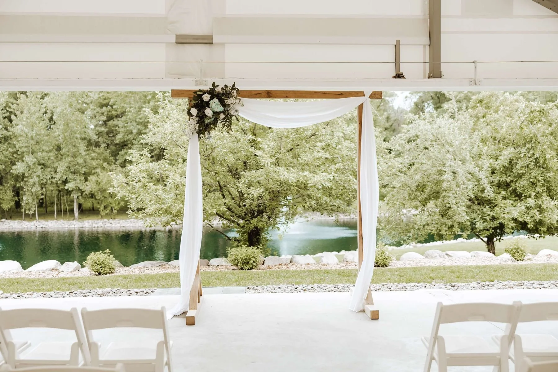 Rainy tent wedding ceremony at Northern Oaks