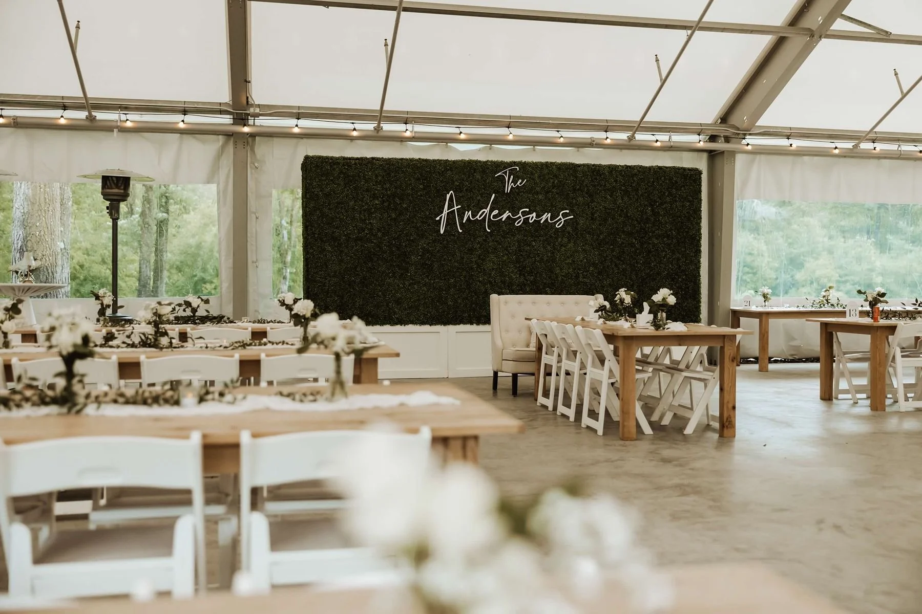 Rainy tent wedding reception at Northern Oaks