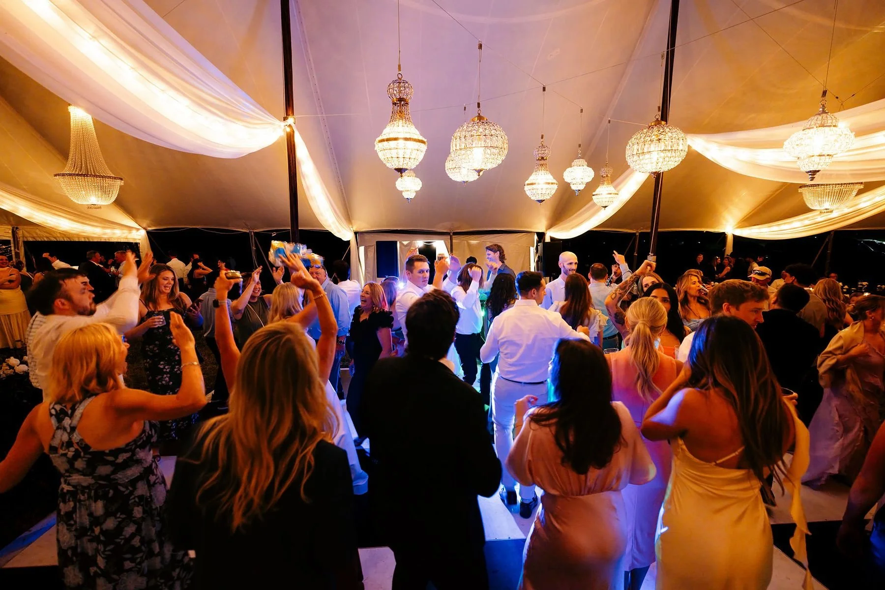 Tent reception dance at outdoor wedding