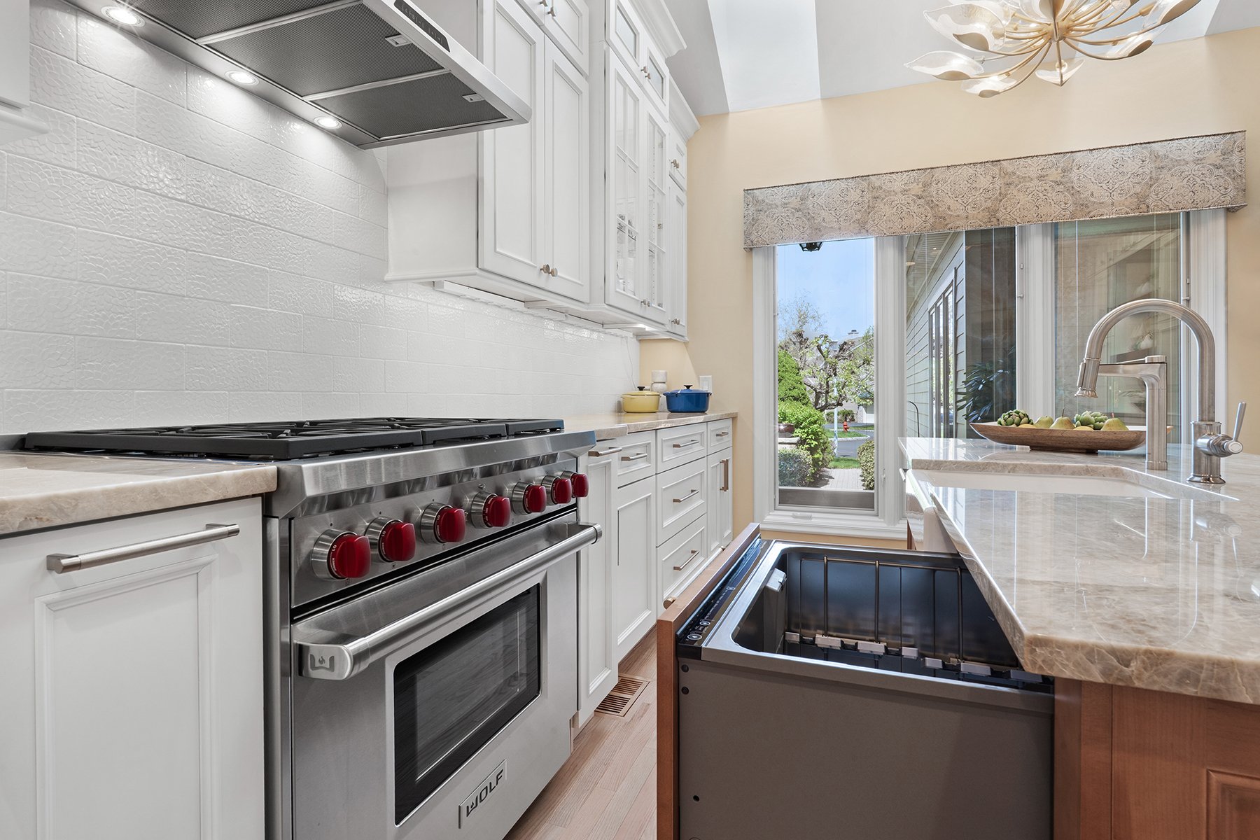Two separate dishwasher drawers are built into the island