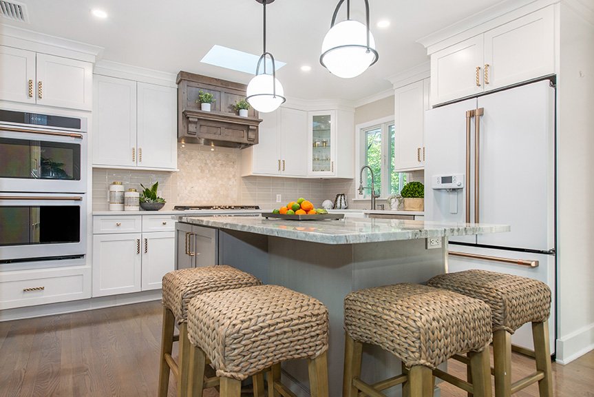 Two backsplash materials provide a stunning focal point at the range.