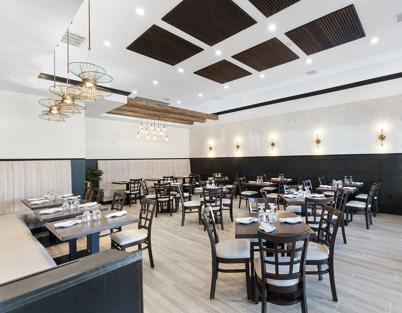 Unique lighting features were installed in certain dining areas to create warm and inviting banquette seating areas.
