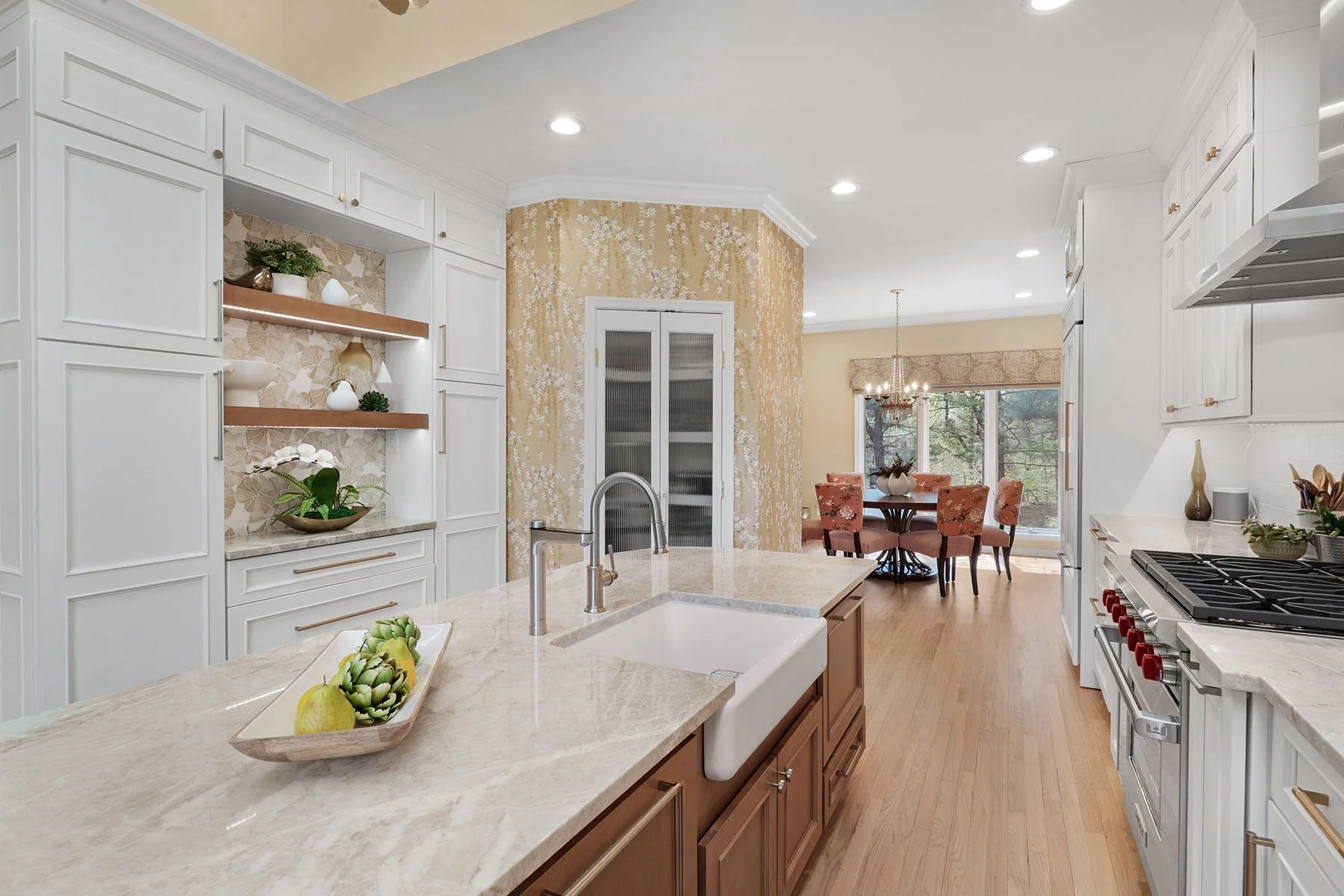 Frosted glass doors conceal the custom butler's pantry built into the curved wall