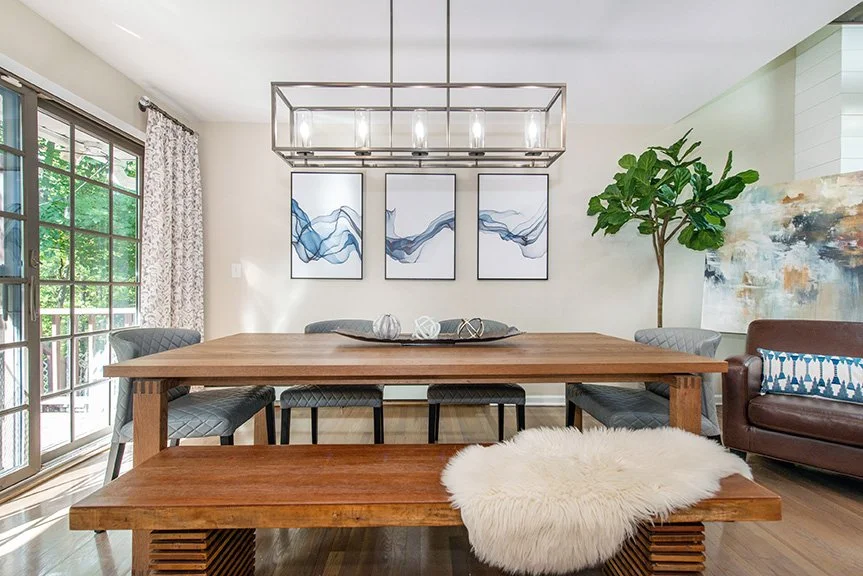 The open concept was further achieved by 
removing existing tile floors and feathering 
in white oak to match the adjacent dining 
and living room, which created one open space