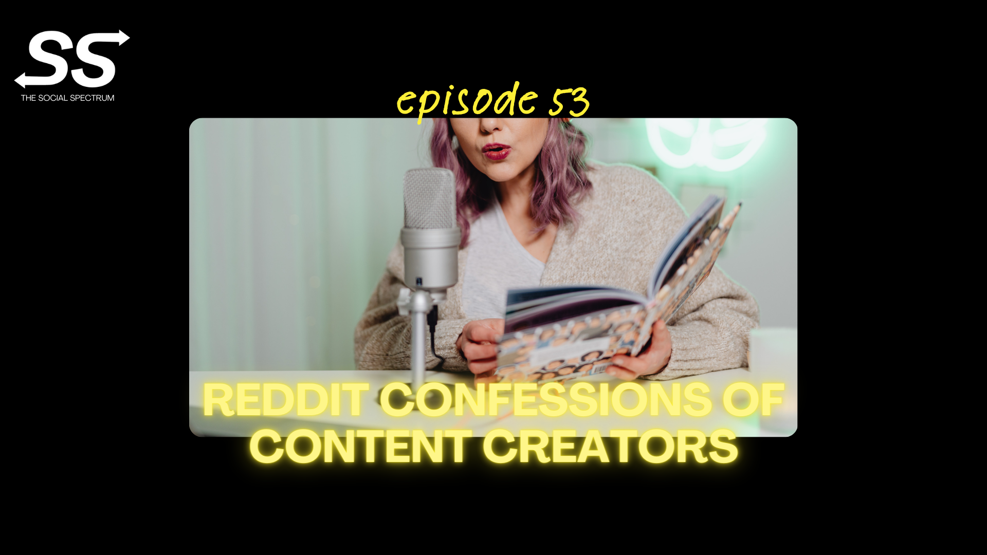 A woman speaking into a microphone while reading from a book