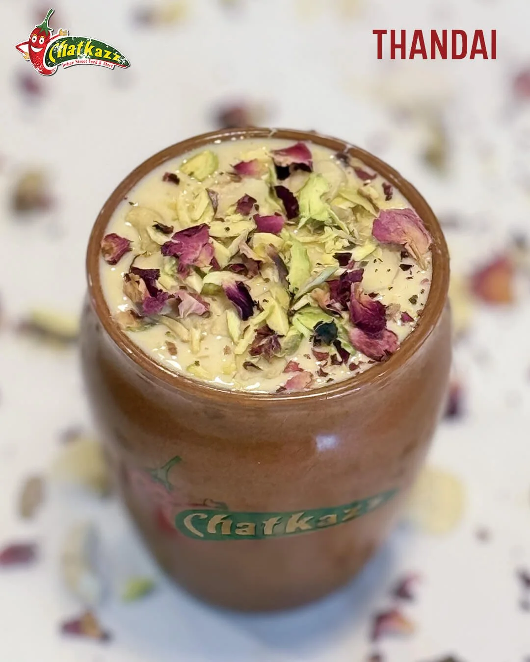 Indian drink thandai in a glass offered by Chatkazz on as Holi special
