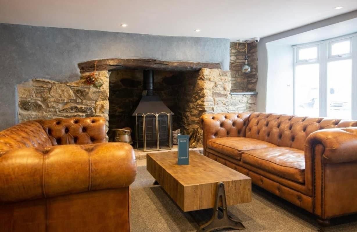 The cosy fireplace & comfy sofas are the place to be in autumn / winter
