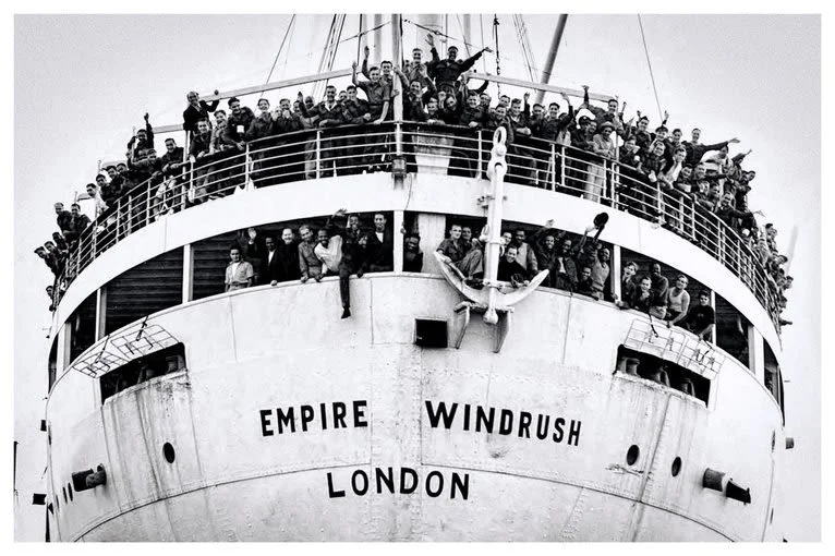 Black and white photograph of people arriving on Empire Windrush