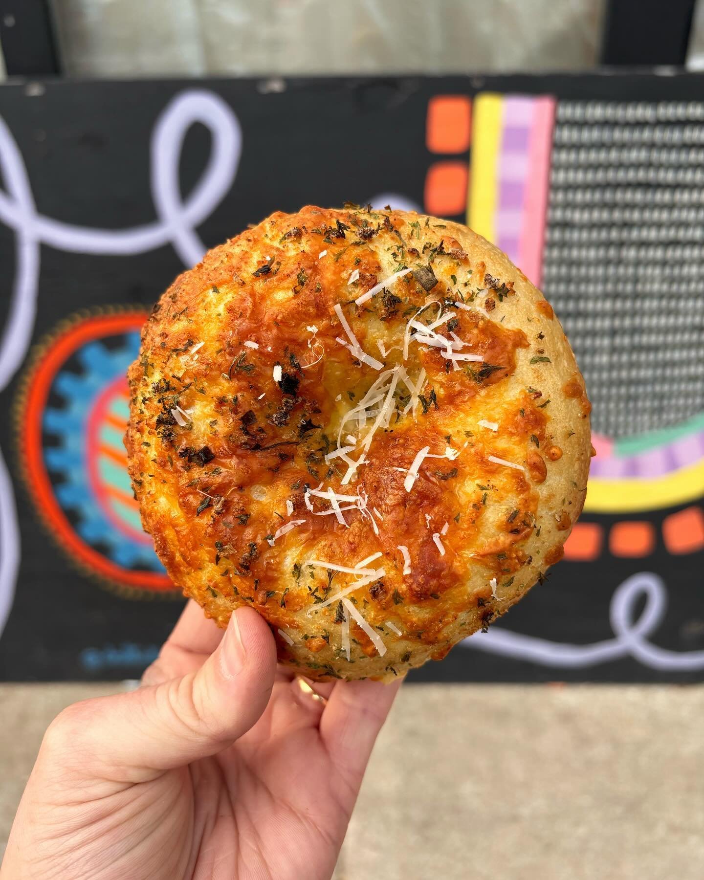 Cheesy Garlic Bagel! 🧀🥯 This weeks BOTW is garlic bread in bagel form 🥹 We can&rsquo;t lie&hellip;. IT&rsquo;S SO GOOD! Roasted garlic &amp; herb dough, topped with a four cheese blend! 
This week only!