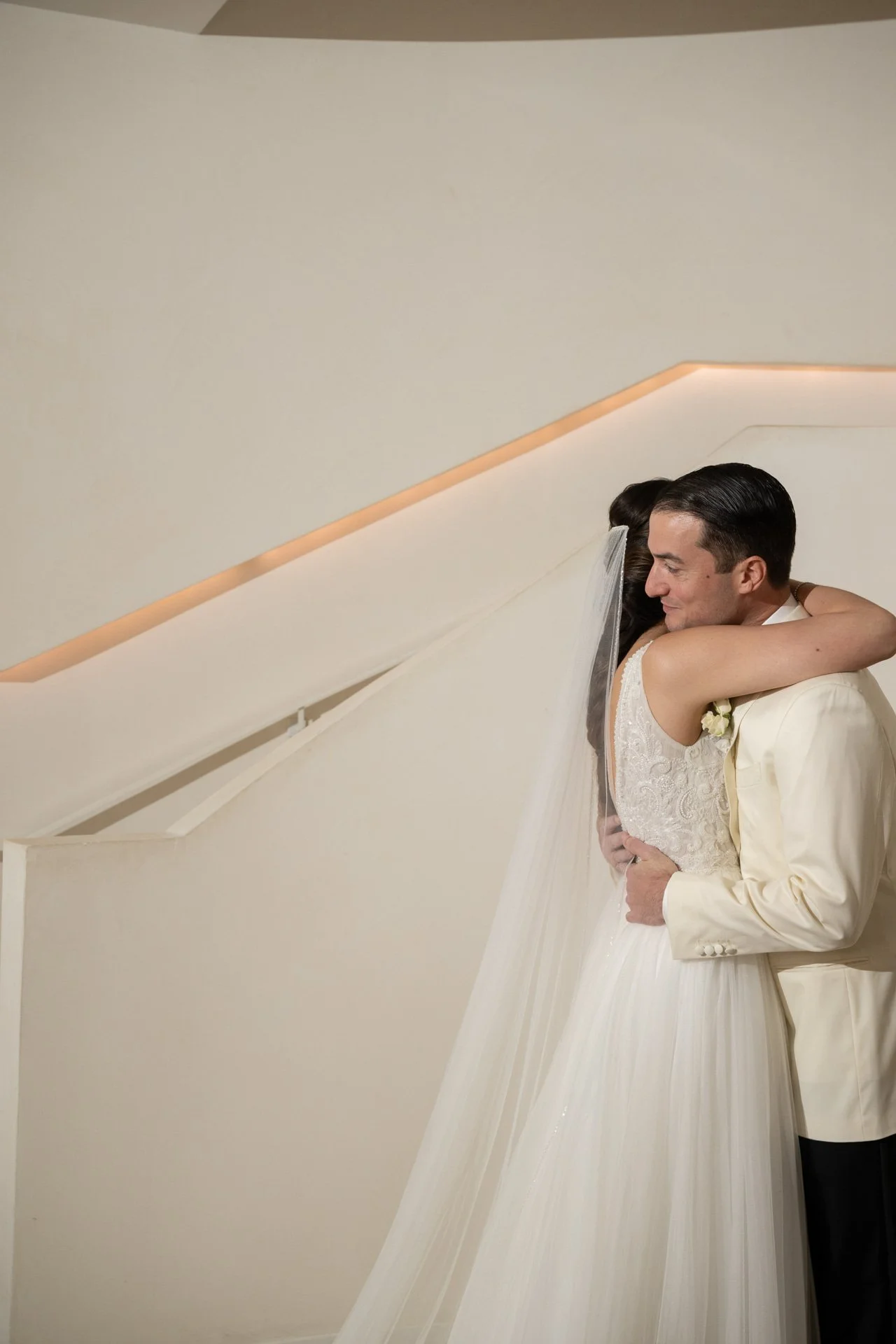 Bride and groom embracing at their luxury Miami Beach wedding
