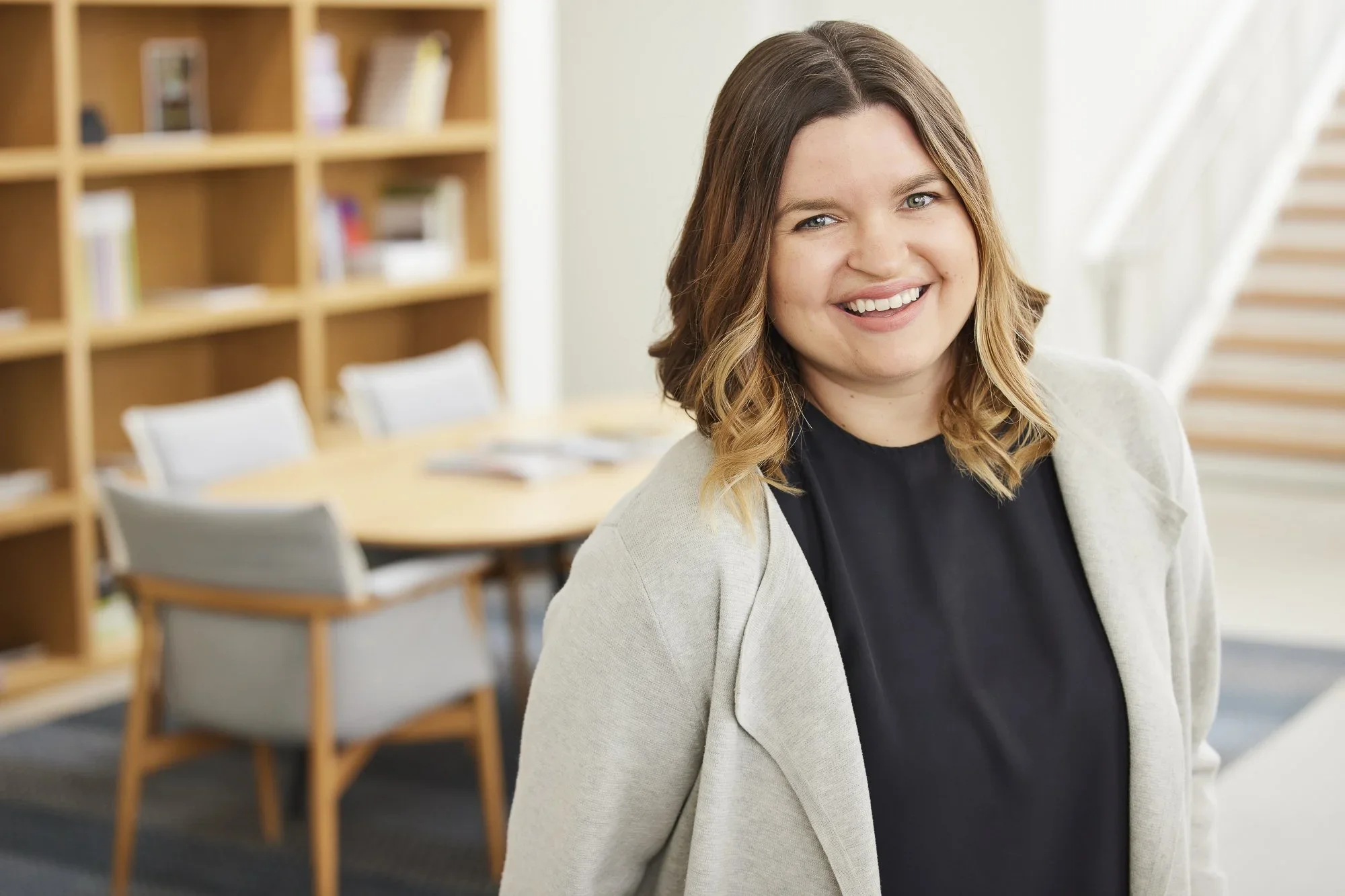 lawrence-anderson-portrait-businesswoman-modern-office.webp