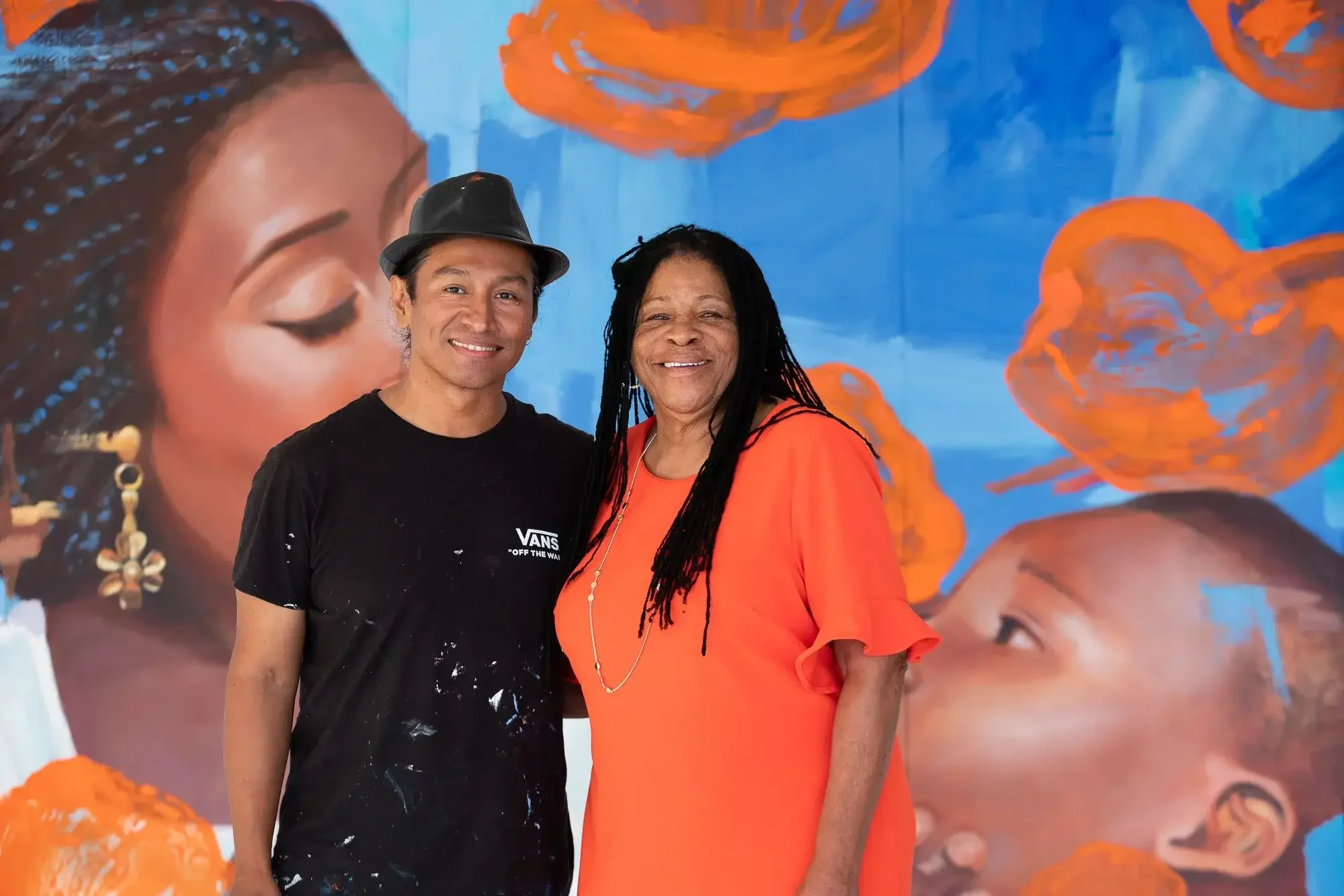 lawrence-anderson-robert-vargas-mural-painting-closeup.webp