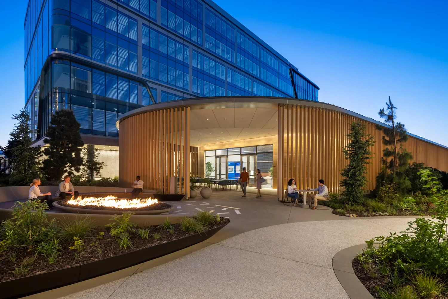 lawrence-anderson-kilroy-oyster-point-outdoor-commons-dusk.webp