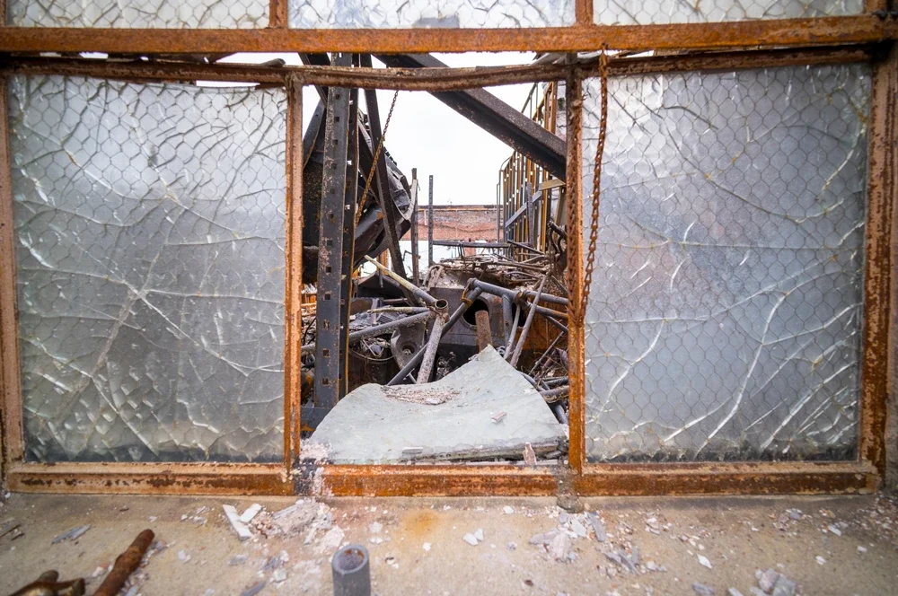 lawrence-anderson-global-initiative-iss-la-fire-relief-broken-window.webp