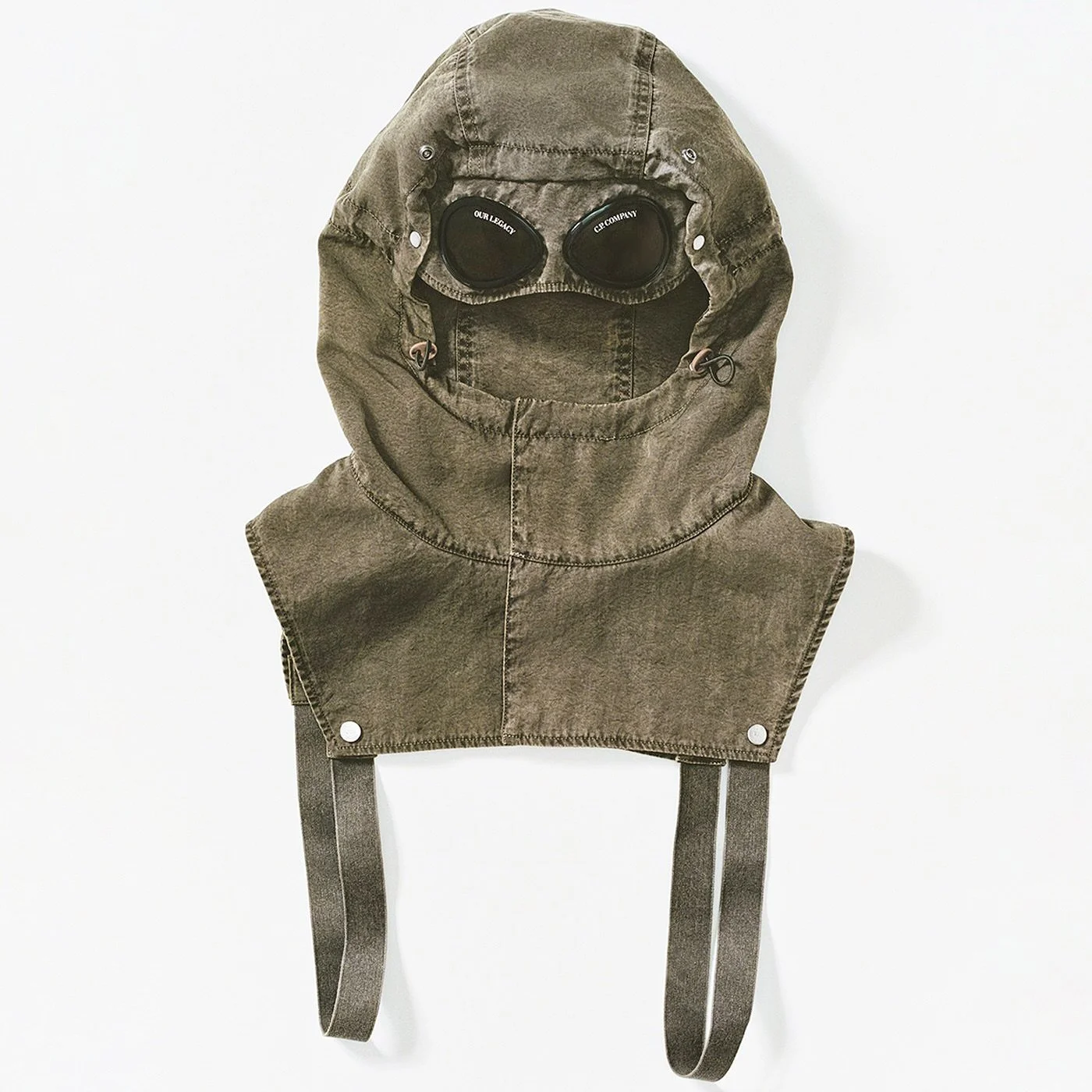 @ourlegacyworkshop x @cpcompany - Mille Hood. 

The Mille hood, made from South Korean oxford nylon, is a collaboration between Our Legacy WORK SHOP and C.P. Company, paying homage to the iconic Mille Miglia hood while adopting a classic Our Legacy h