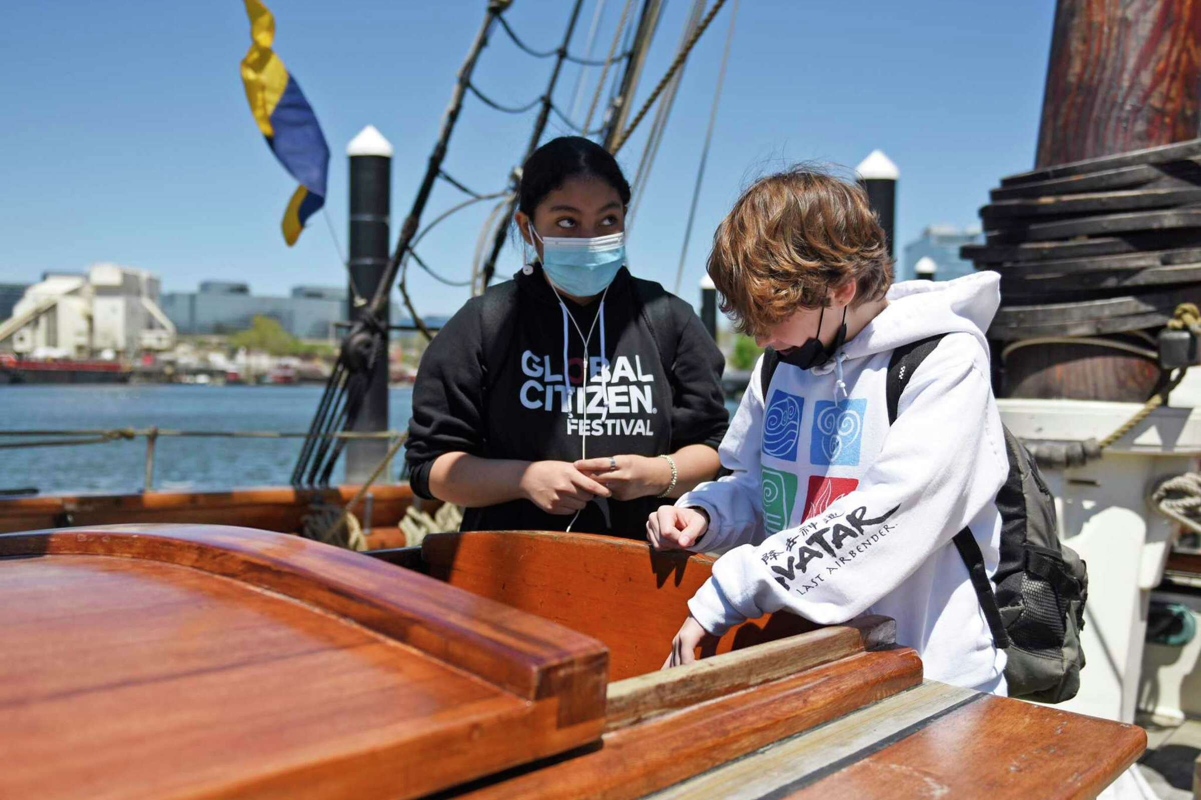  Eighth-graders Sophia Martinez and Vinny Petruso looks beneath the deck aboard a reproduction of the Amistad slave ship docked at Harbor Point in Stamford, Conn. Monday, May 9, 2022. Eighth grade students toured the ship to kick off the new partners