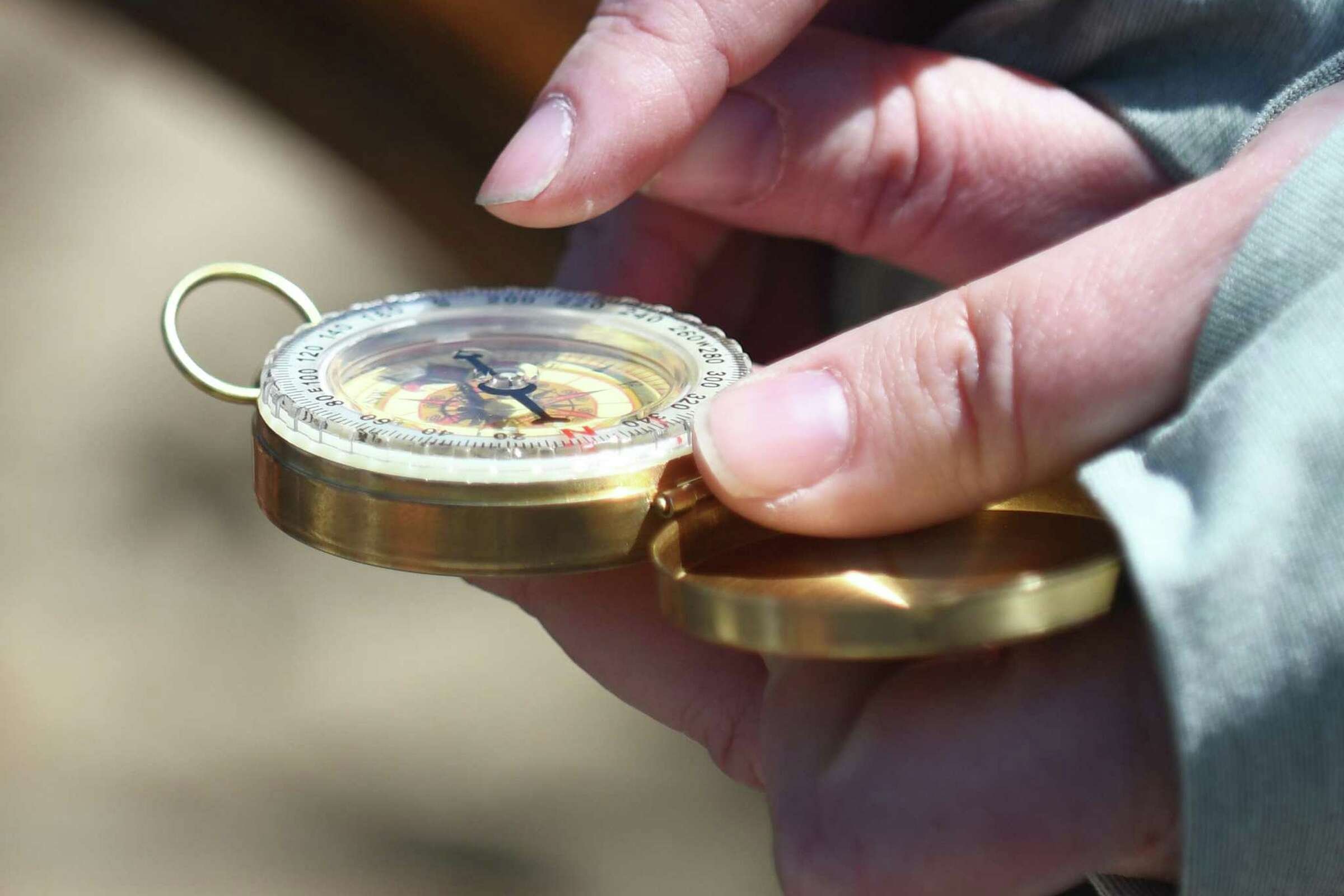  Discover Amistad educator Heidi Slaney shows students how to use a compass aboard a reproduction of the Amistad slave ship docked at Harbor Point in Stamford, Conn. Monday, May 9, 2022. Eighth grade students toured the ship to kick off the new partn