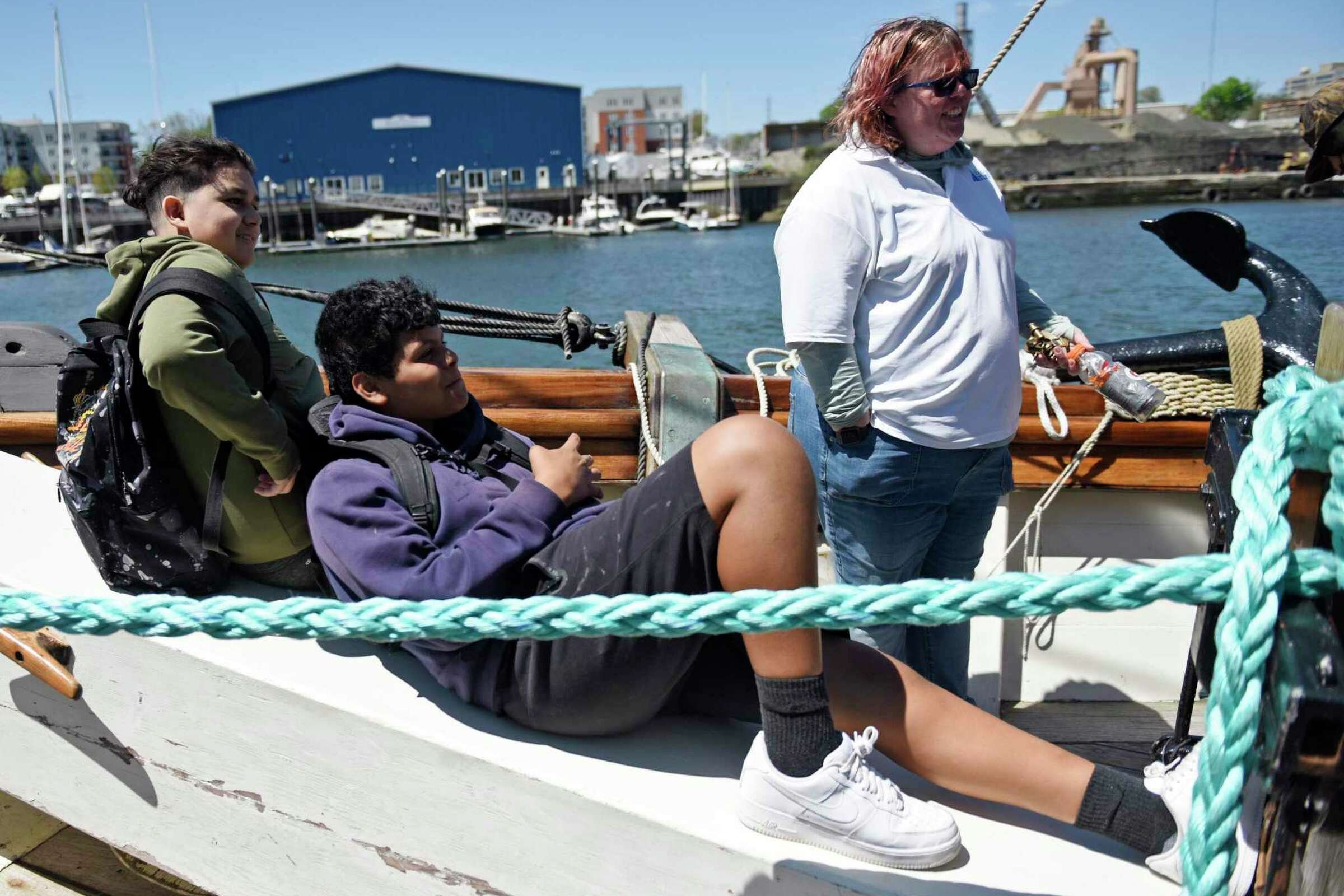  Eighth-graders Sergio Espina, left, and Eduardo Quintana listen to history lesson aboard a reproduction of the Amistad slave ship docked at Harbor Point in Stamford, Conn. Monday, May 9, 2022. Eighth grade students toured the ship to kick off the ne