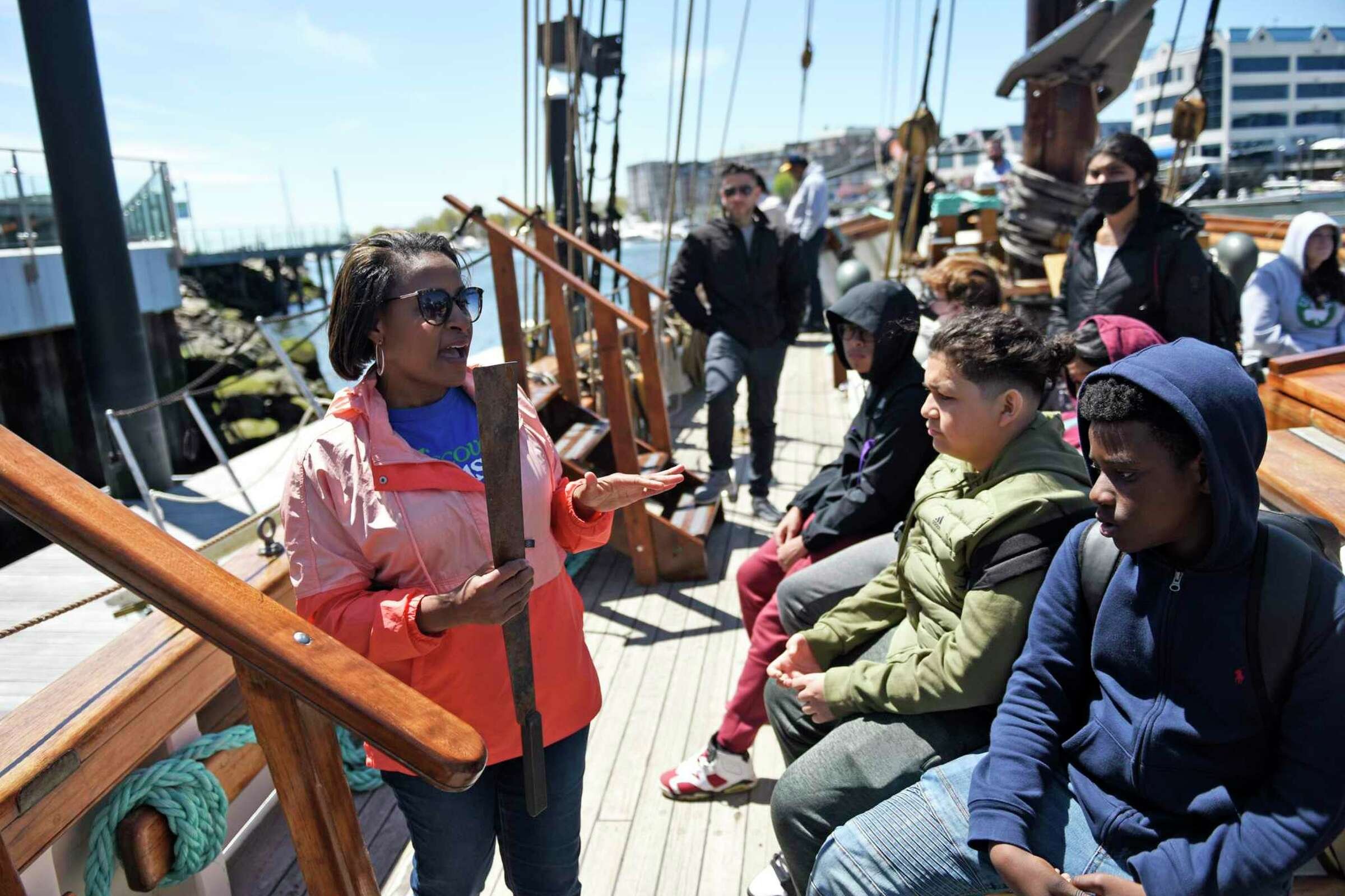  Discover Amistad educator Reeshemah Nofleet tells students the history of the Amistad uprising aboard a reproduction of the ship docked at Harbor Point in Stamford, Conn. Monday, May 9, 2022. Eighth grade students toured the ship to kick off the new