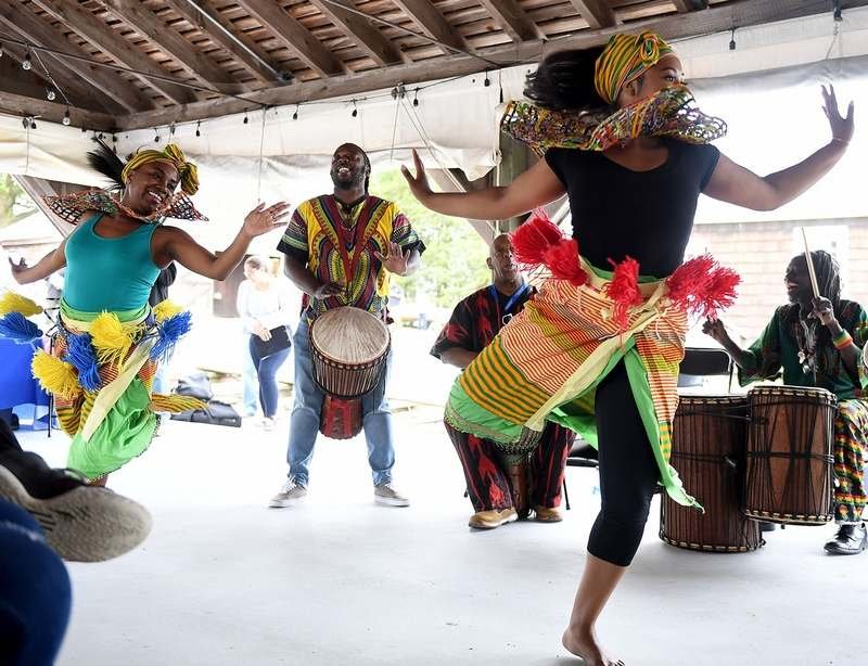  EvaE Peart, left, of New York and Nikki Hartfield, of Hartford, preform a traditional liberte dance during a Juneteenth Celebration at the Mystic Seaport Museum on Sunday, June 19, 2022. Liberte is a rhythm of music from West Africa designed to comm