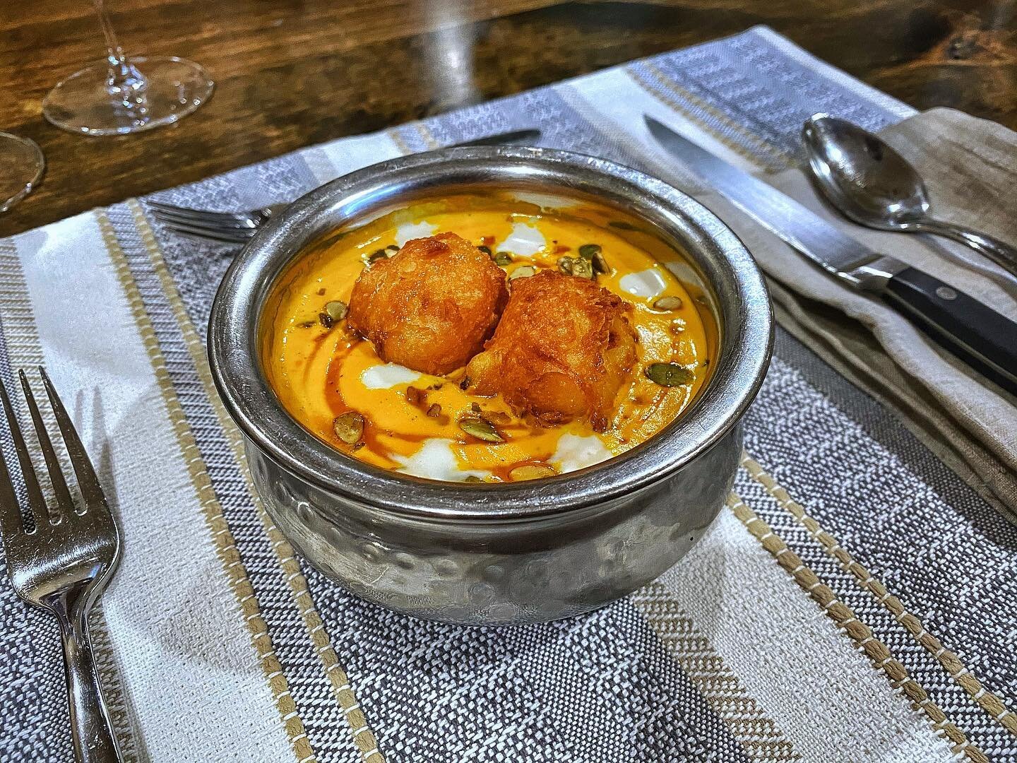 Carrot soup.
.
Heirloom carrots slow roasted in a cast iron skillet over coffee beans. Goat&rsquo;s cheese beignets, clove infused maple, creme friache, toasted pumpkin seed.
.
#radass #carrots #coffee #soup #soupseason #lickthebowl #slurp #maple #go