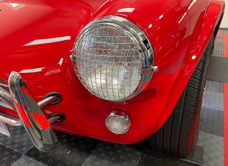 Headlight Trim Rings Riveted with Stone Guards.jpg