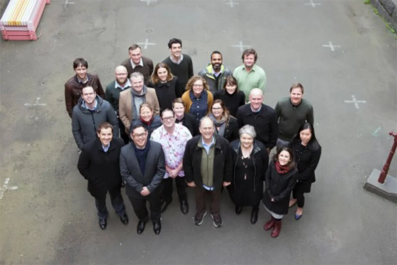 Bright natural dining room nook with vases plates and fruits on the table.