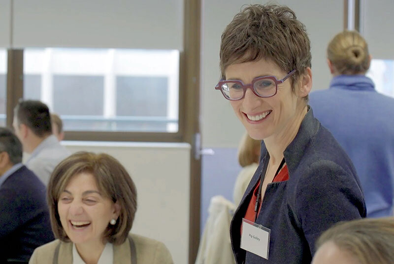 Scenic shot of the beach with waves hitting the rocks.