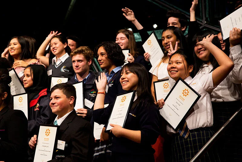 Pretty Caucasian woman at the beach smiling at camera.
