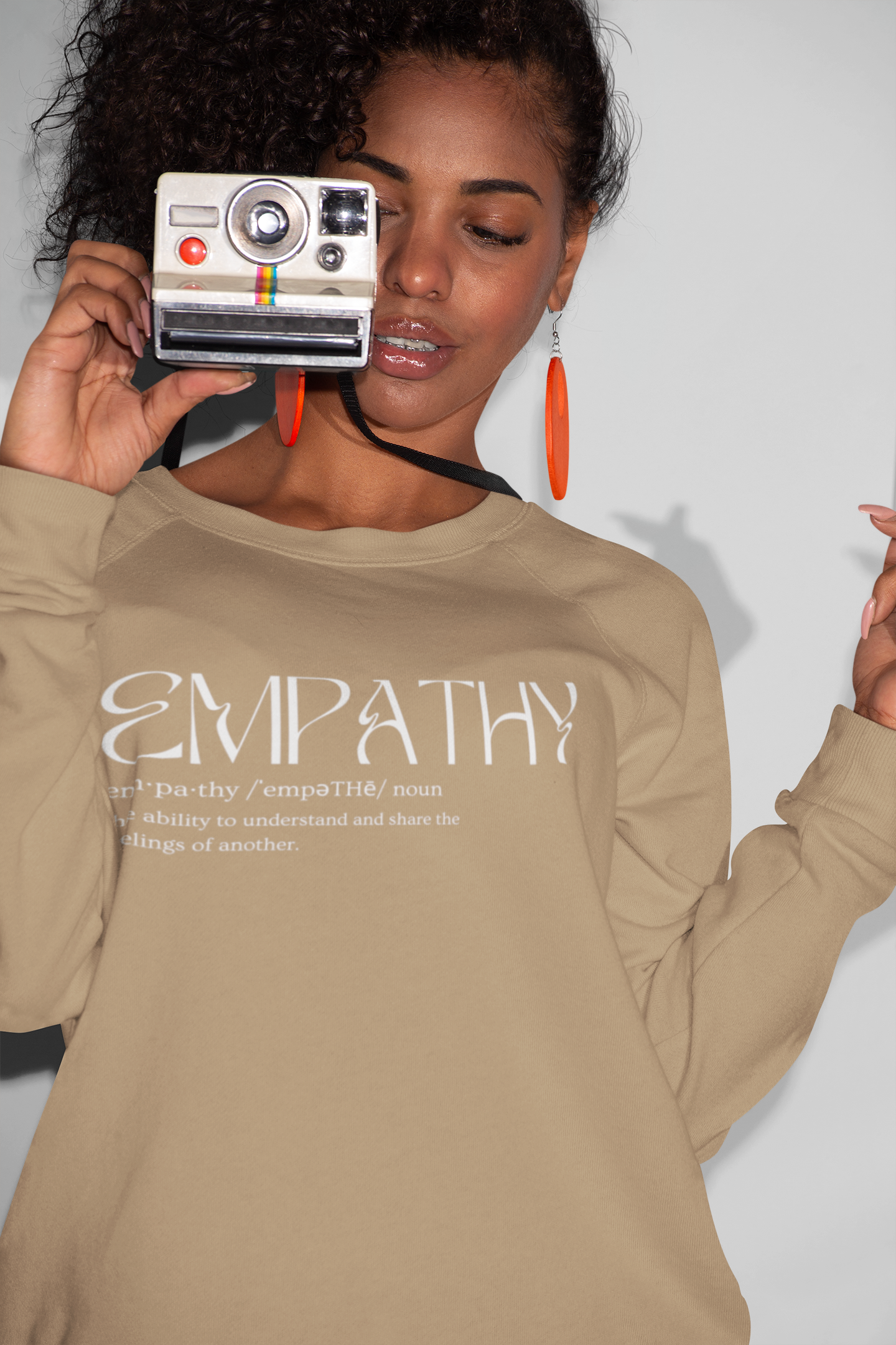 crewneck-sweatshirt-mockup-of-a-girl-holding-a-retro-instant-camera-21910.png