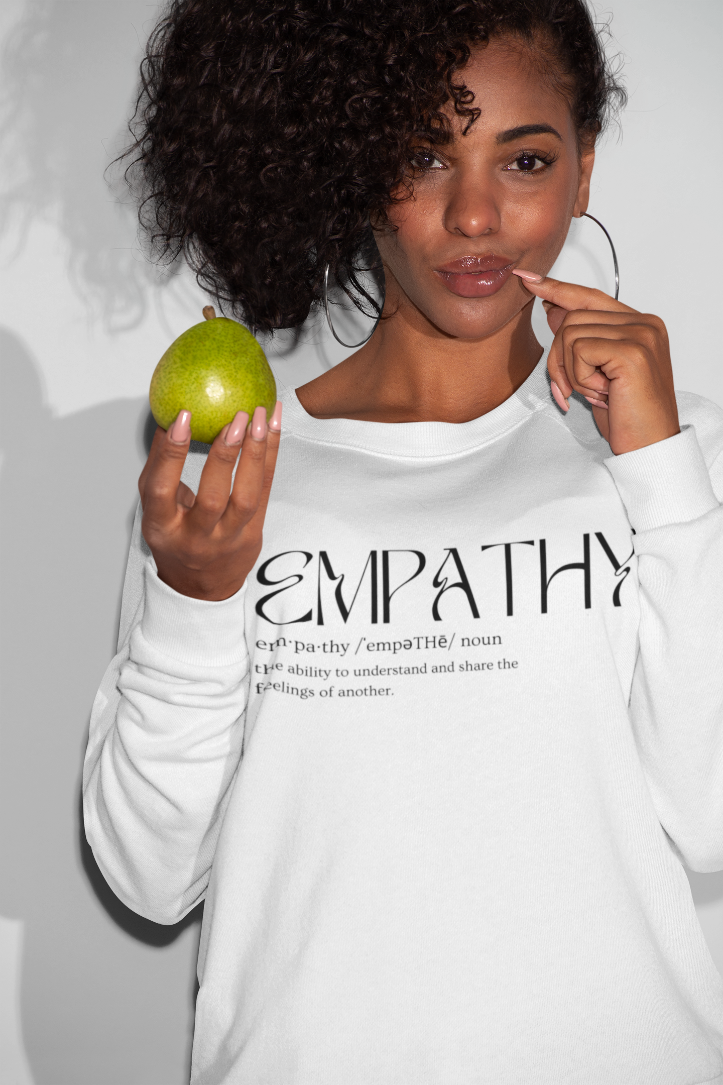 sweatshirt-mockup-of-a-woman-posing-with-a-fruit-in-her-hand-21909.png