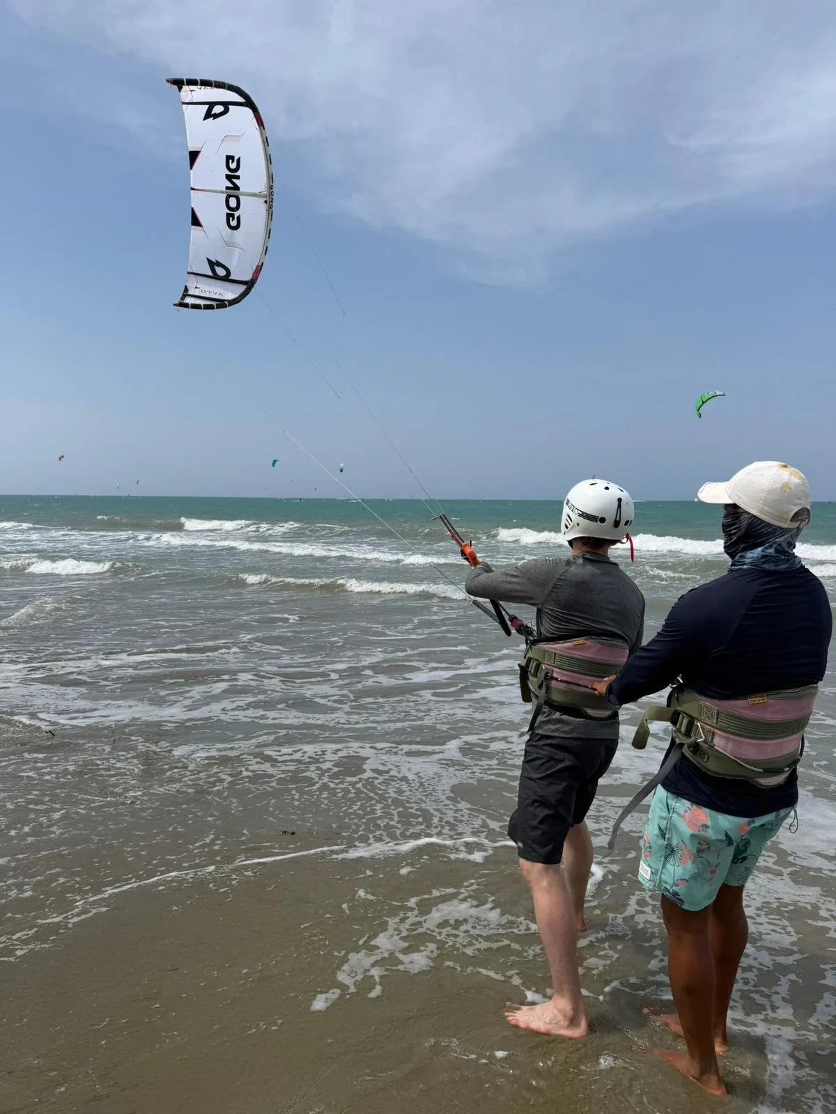 Many kites flying over Kite Beach Cabarete during peak summer wind season