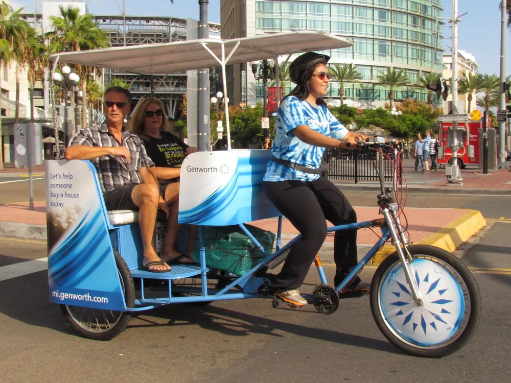 Riders enjoying a pedicab tour