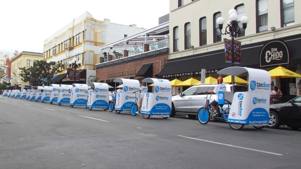 Fully wrapped TaxDoor pedicabs in the Gaslamp Quarter