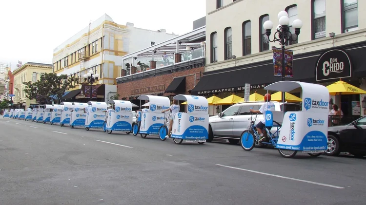 Fully wrapped TaxDoor pedicabs in the Gaslamp