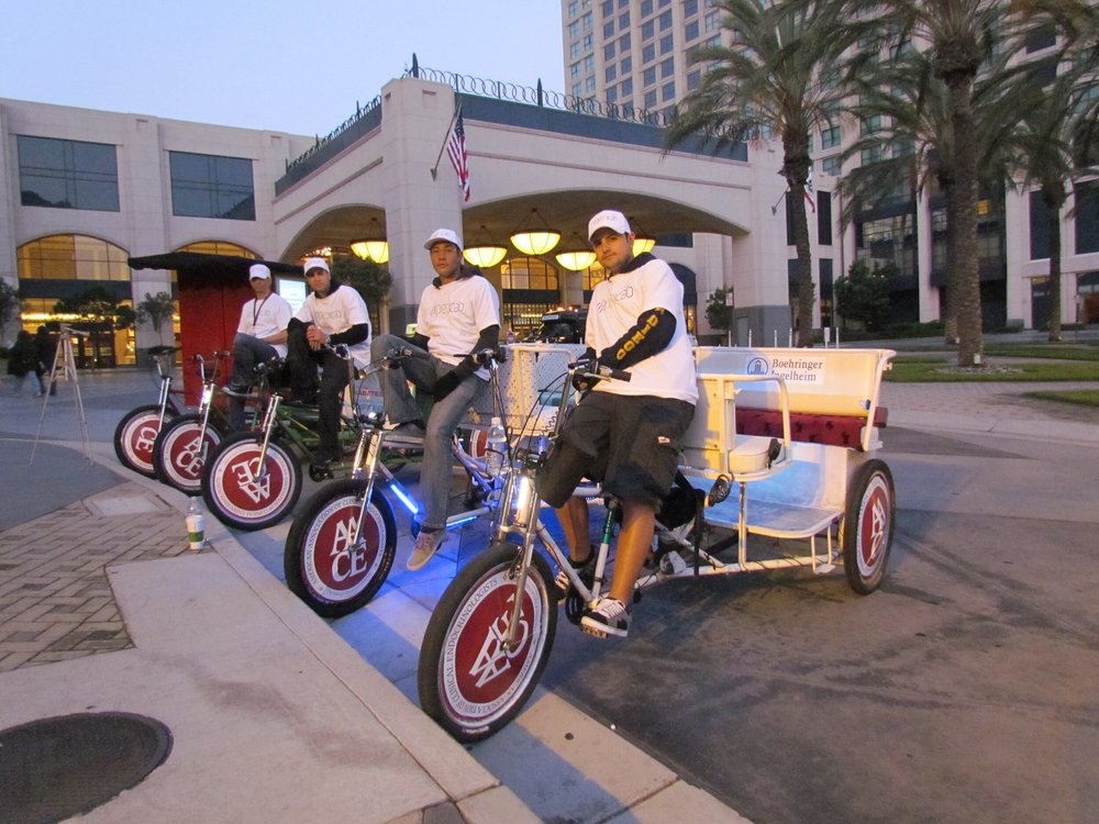 Pedicabs waiting outside a downtown hotel