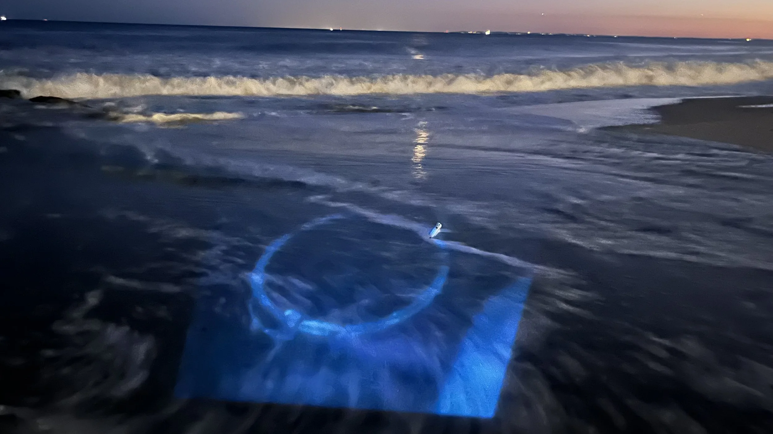 Time-based projection — ocean, sand.
