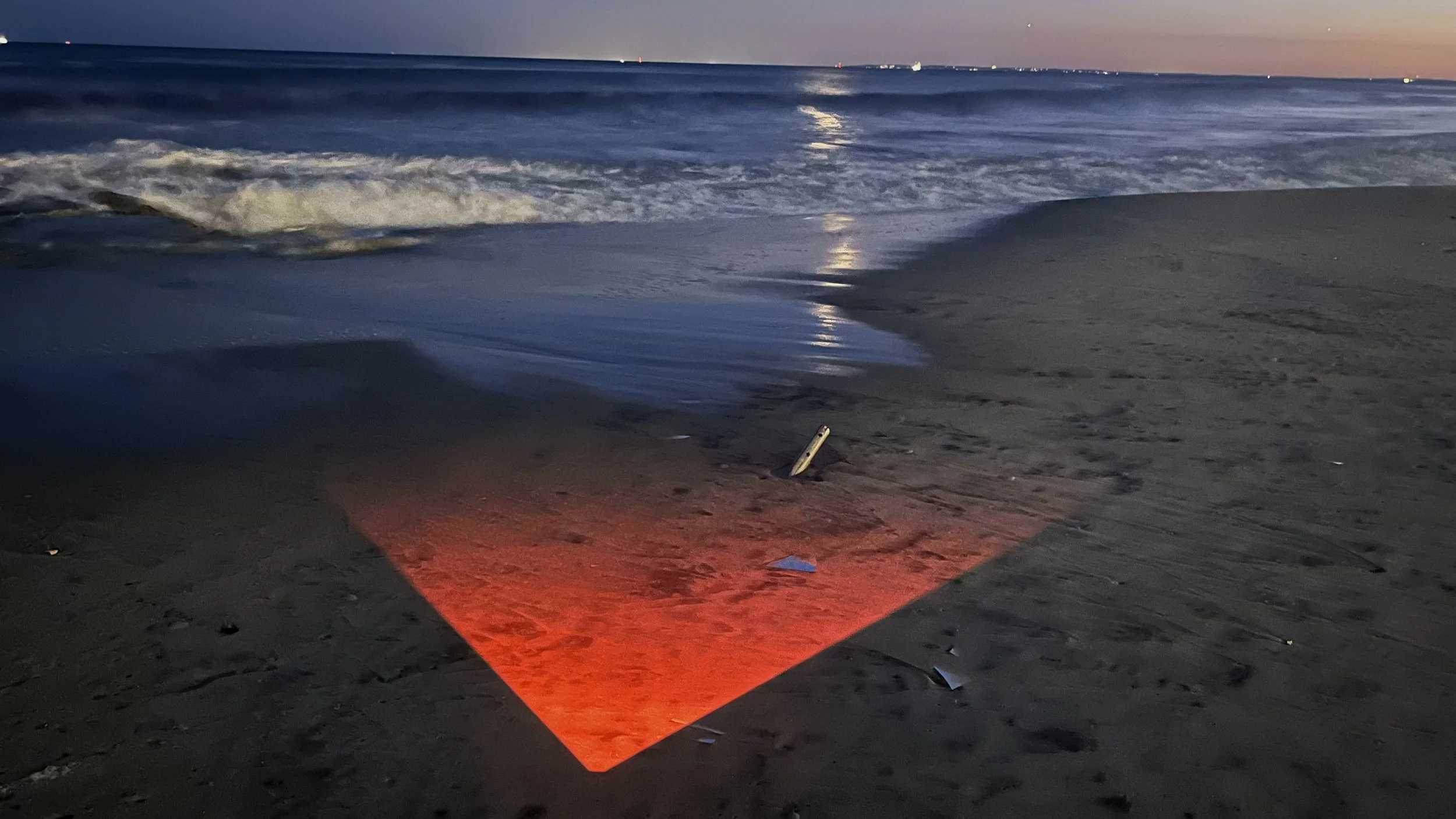 Time-based projection — ocean, sand.