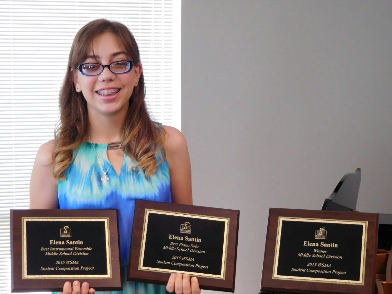 Luka proudly posing with their three WSMA plaques (2015).