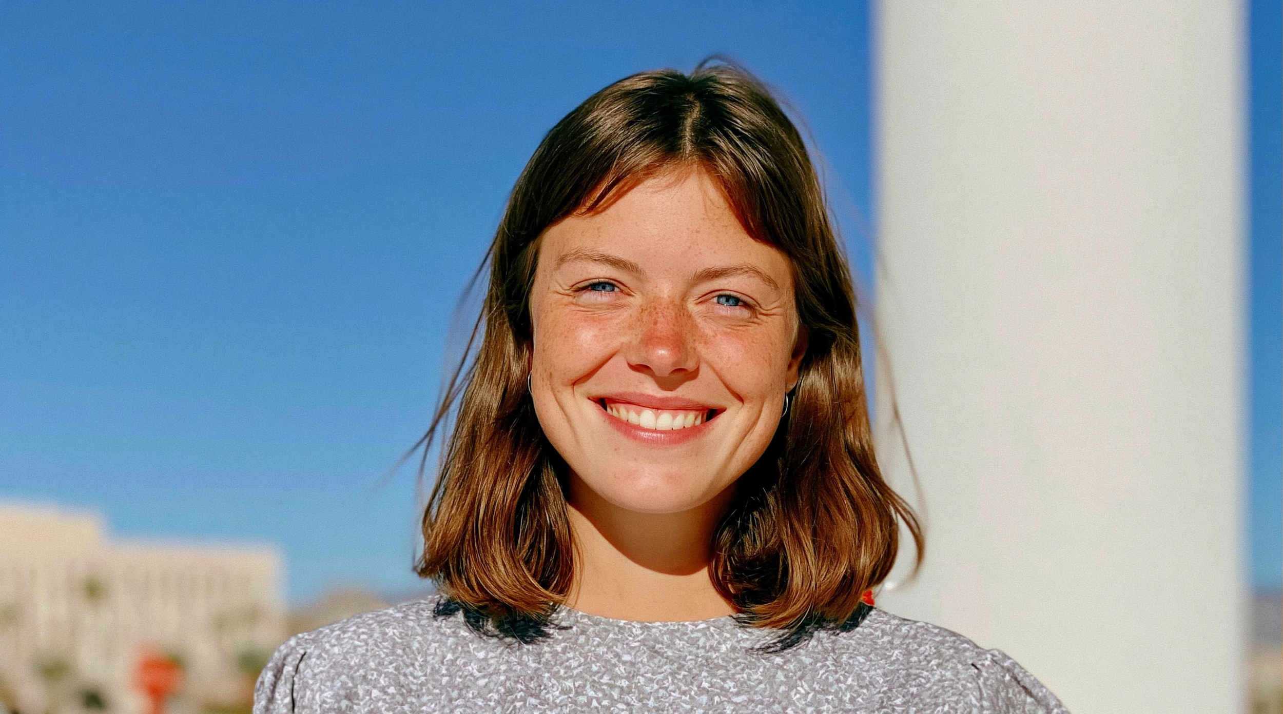 lucasmelb_a_portrait_photo_of_a_smiling_woman_with_shoulder_l_b221436e-d1a1-4992-8503-116a3e75ff02_0.png