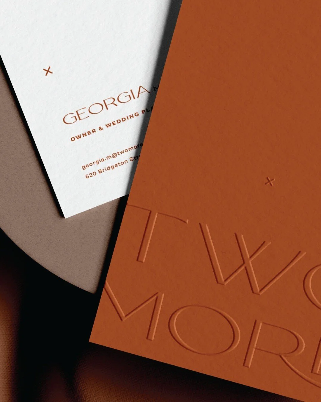 Business cards for Two More&mdash;a boutique wedding planning team that's committed to every precious detail of your special day. Blind embossed to perfection on luxurious cotton paper in a rich shade of savannah.

Conceptual brief by @hellotayloramy