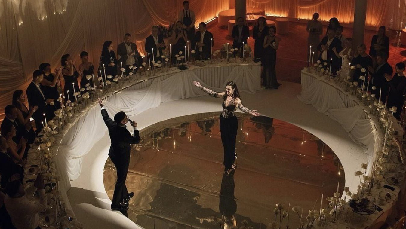 "Professional performers entertaining guests at a high-end gala dinner in Hong Kong with elegant decor and stage lighting"