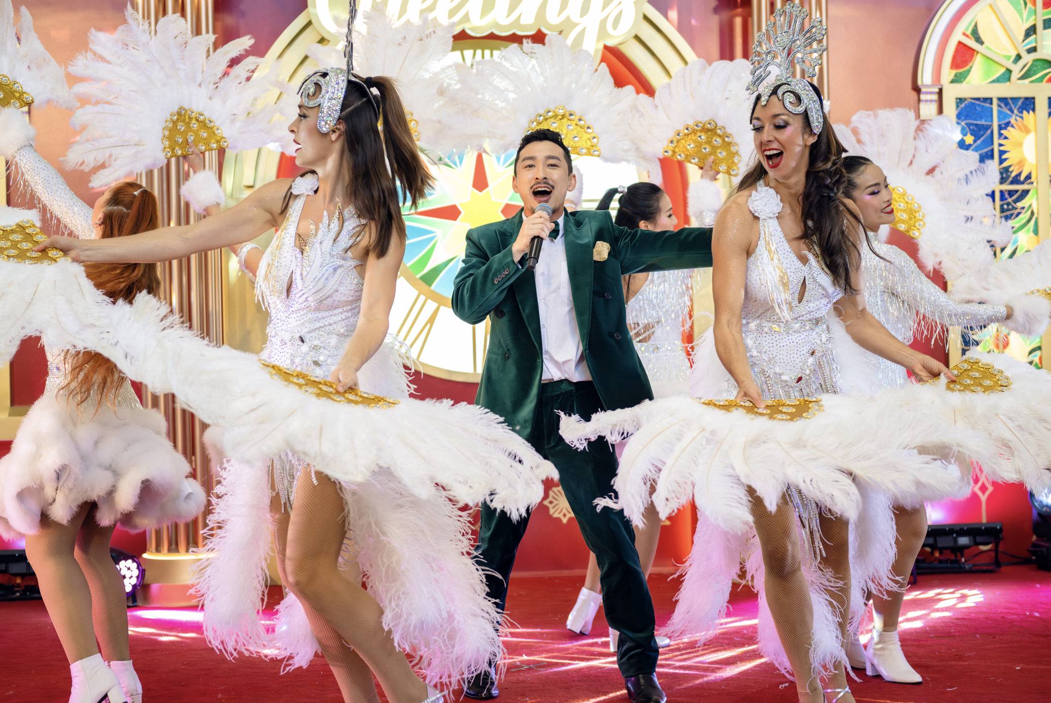 Synchronized Broadway dancers by BPM Productions Hong Kong performing a high-energy holiday routine at Hong Kong International Airport.
