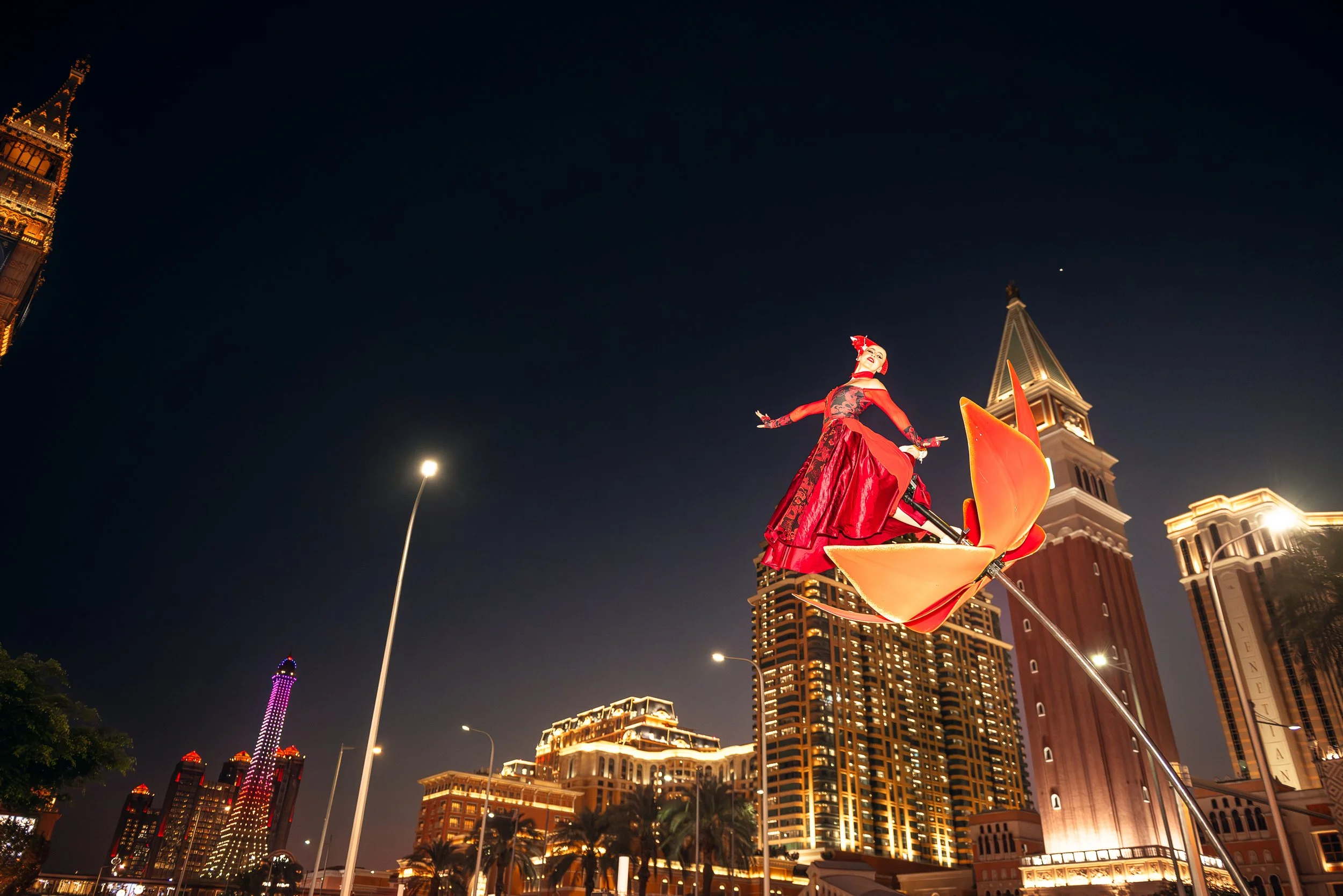 Nighttime outdoor activation at City of Dreams Macau featuring a professional BPM Sway Pole performance.